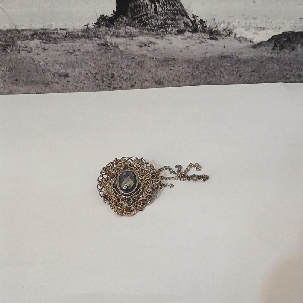 Vintage-Inspired Gold and Black Brooch